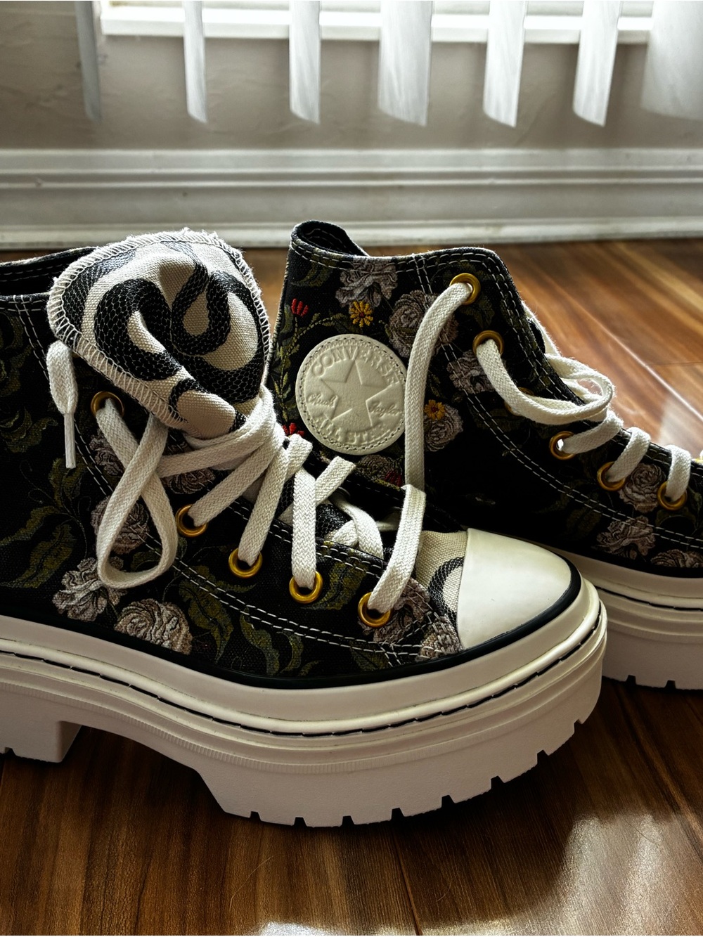Converse Black Floral Platform Chuck Taylor High Tops with White Accents